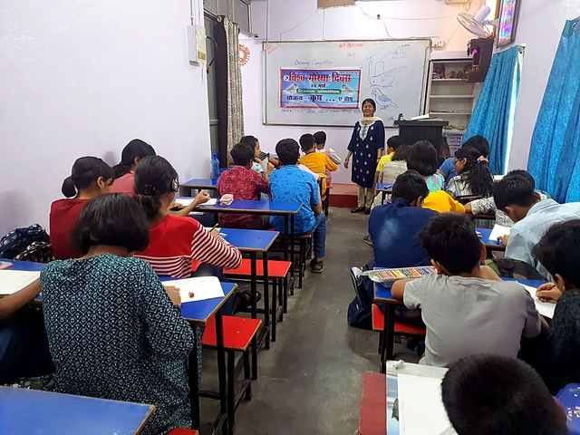 People working at computers in a training lab