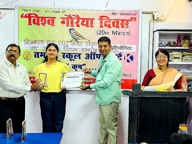 Children with certificates standing with teachers