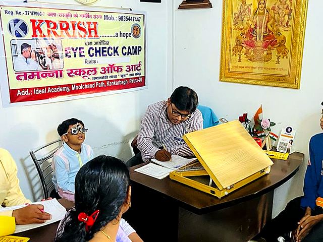 Doctors examining patients at a free eye check-up camp